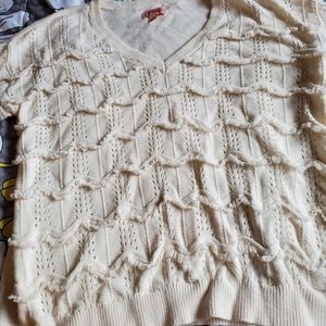 Creamy white fringed sweater